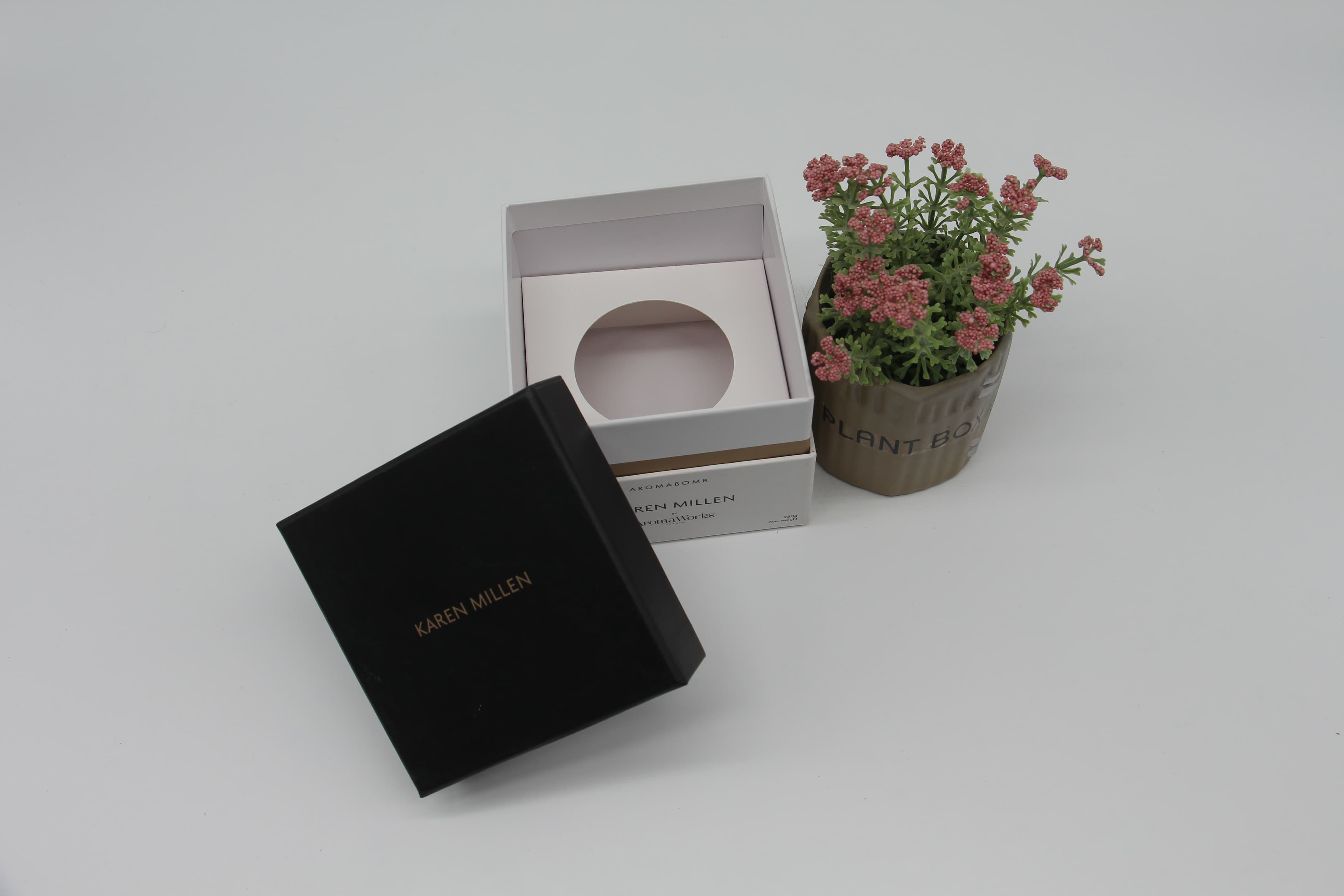 Rigid cosmetic set box with three product cavities