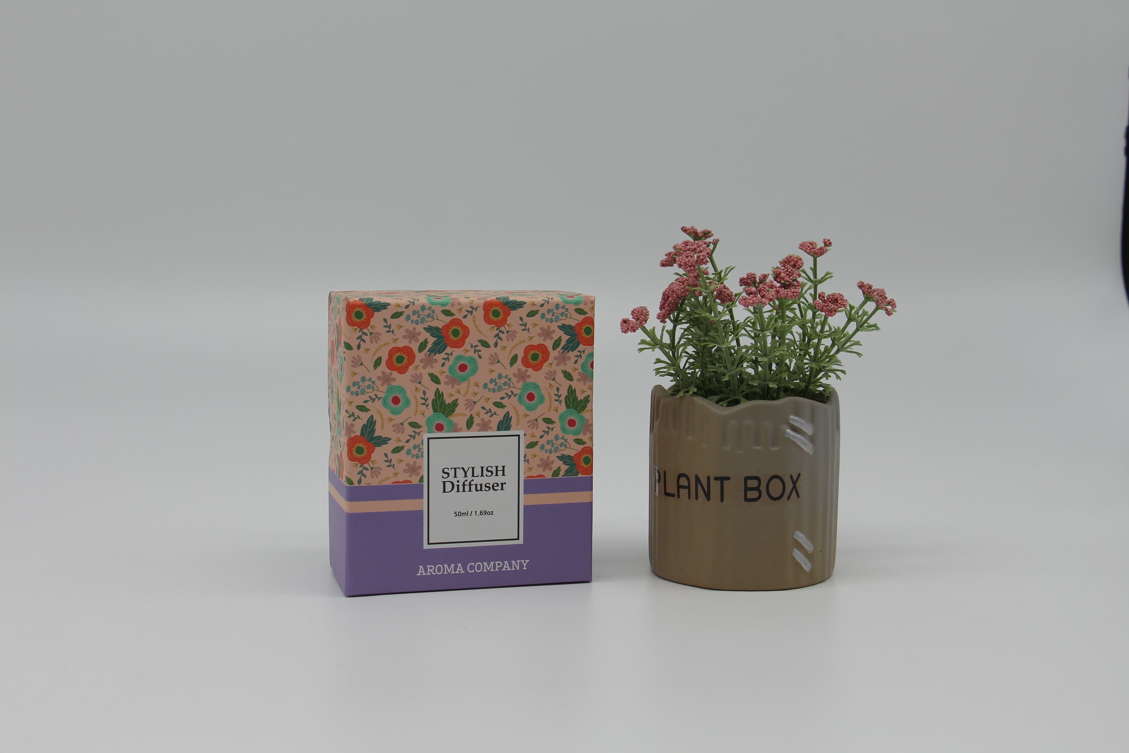 Two-piece rigid box with embossed logo lid